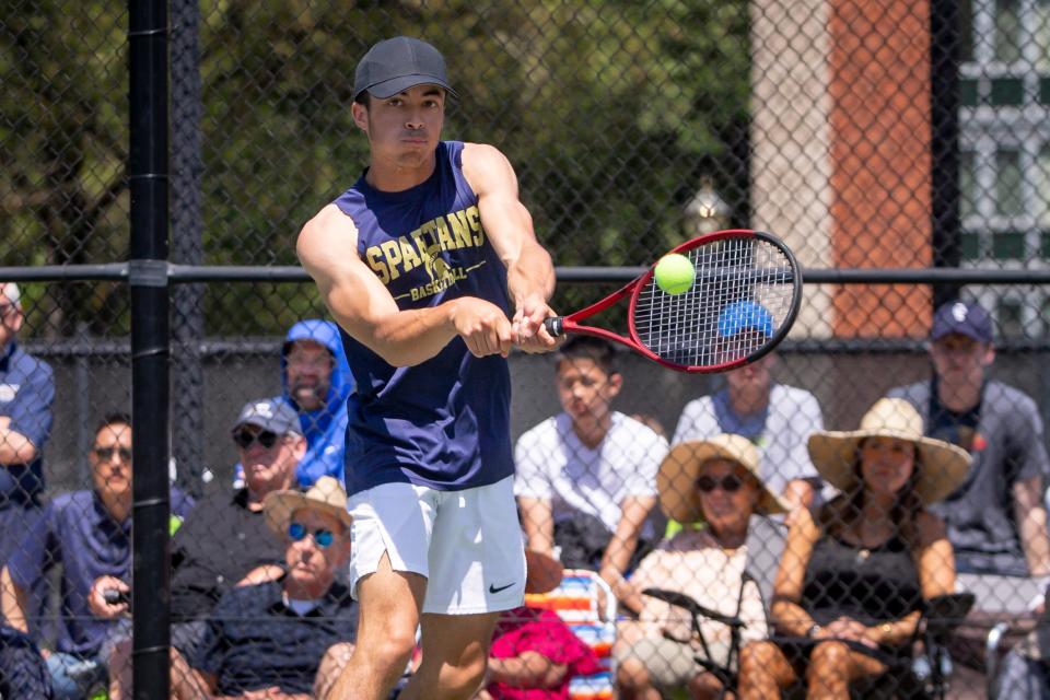 Marist’s Peyton Tyner goes after the ball during the final doubles match at the OSAA Class 4A/3A/2A/1A tennis state championship at Oregon State University in Corvallis Saturday, May 20,2023.