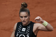 Greece's Maria Sakkari clenches her fist after winning a point to Karolina Muchova of the Czech Republic during their second round match of the French Open tennis tournament at the Roland Garros stadium Wednesday, May 25, 2022 in Paris. (AP Photo/Thibault Camus)