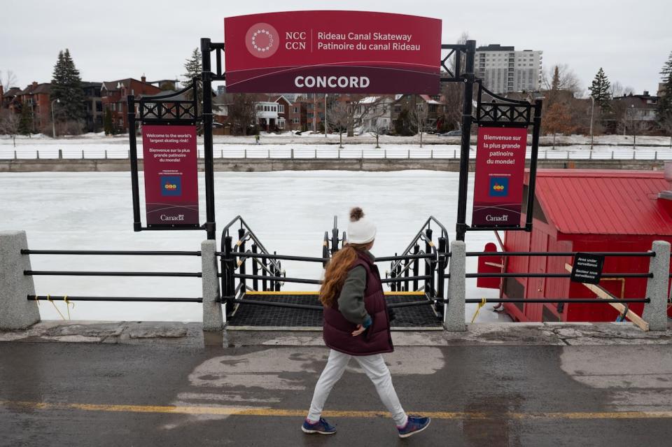 A person walks along the closed Rideau Canal Skateway in Ottawa Feb. 16, 2023. 