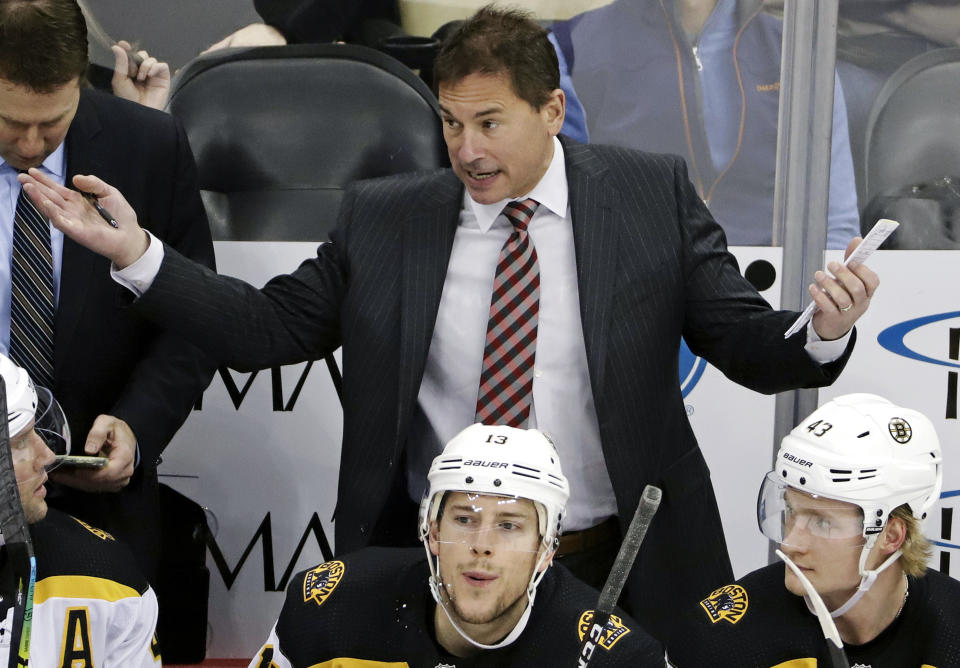 FILE - In this March 10, 2019, file photo, Boston Bruins head coach Bruce Cassidy gives instructions during the first period of an NHL hockey game against the Pittsburgh Penguins in Pittsburgh. Cassidy's Bruins will face the St. Louis Blues in Game 1 of the Stanley Cup Final on Monday, May 27, 2019, in Boston. (AP Photo/Gene J. Puskar, File)