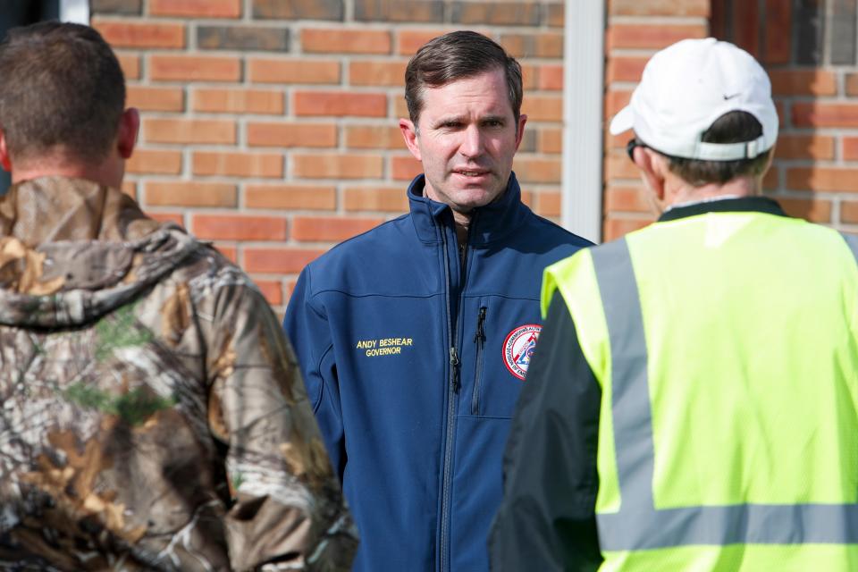 Gov. Andy Beshear speaks with city officials in Dawson Springs in the aftermath of devastating tornadoes in December 2021.