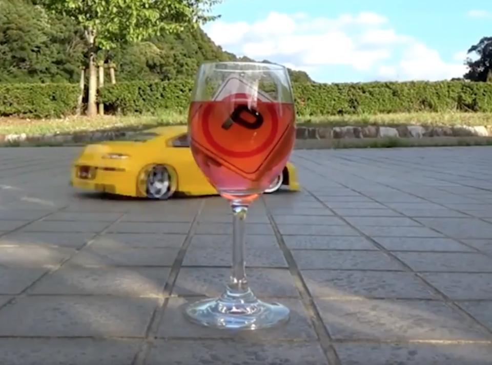 <em>Skill – the videos show the car being drifted around wine glasses without spilling a drop (Pictures: Caters)</em>