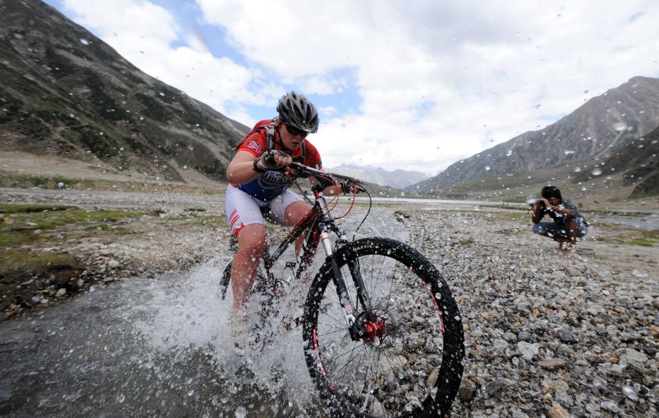 Great Britain's cyclist Rickie Cotter rides during the second stage of the Himalayas 2011 International Mountainbike Race in the mountainous area of Lake Saif-ul-Maluk in Pakistan's tourist region of Naran in Khyber Pakhtunkhwa province on September 17, 2011. The cycling event, organised by the Kaghan Memorial Trust to raise funds for its charity school set up in the Kaghan valley for children affected in the October 2005 earthquake, attracted some 30 International and 11 Pakistani cyclists. AFP PHOTO / AAMIR QURESHI (Photo credit should read AAMIR QURESHI/AFP/Getty Images)