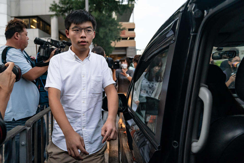 HONG KONG, CHINA - AUGUST 30: Hong Kong pro-democracy Joshua Wong leaves the Eastern Magistrates' Courts after being arrested and released on bail on August 30, 2019 in Hong Kong, China. Pro-democracy protesters have continued demonstrations across Hong Kong since 9 June against a controversial bill which allows extraditions to mainland China as the ongoing protests surpassed the Umbrella Movement five years ago, becoming the biggest political crisis since Britain handed its onetime colony back to China in 1997. Hong Kong's embattled leader Carrie Lam apologized for introducing the bill and declared it "dead", however the campaign continues to draw large crowds to voice their discontent while many end up in violent clashes with the police as protesters show no signs of stopping. (Photo by Anthony Kwan/Getty Images)