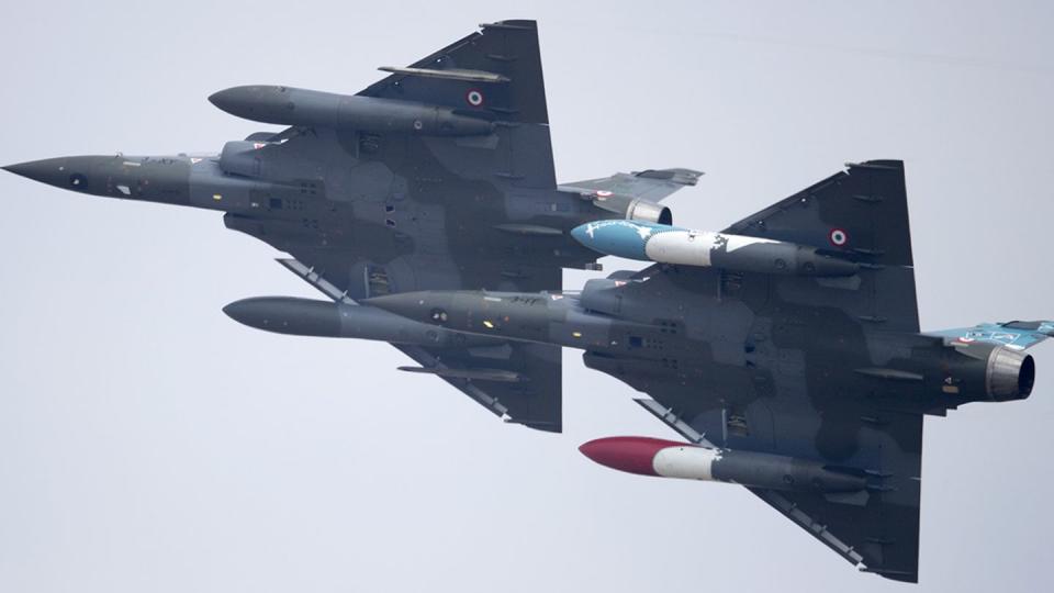 Two Mirage 2000D aircraft perform at a 2018 air show in England. (Matt Cardy/Getty Images)