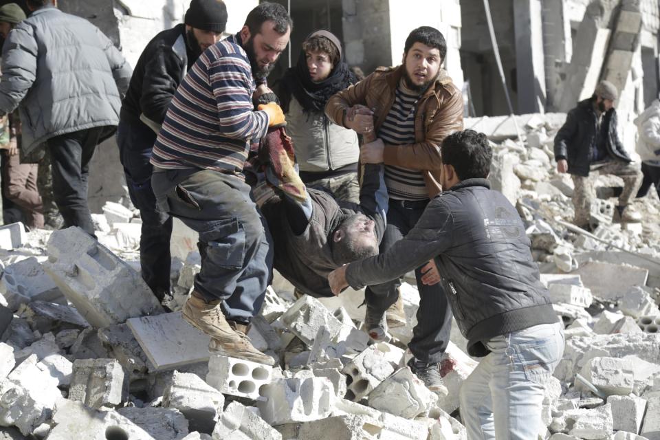 ATTENTION EDITORS - VISUAL COVERAGE OF SCENES OF DEATH AND INJURYResidents carry an injured man in a site hit by what activists said were airstrikes carried out by the Russian air force in the rebel-controlled area of Maaret al-Numan town in Idlib province, Syria January 9, 2016. At least 70 people died in what activists said where 4 vacuum bombs dropped by the Russian air force in the town of Maaret al-Numan; other air strikes were also carried out in the towns of Saraqib, Khan Sheikhoun and Maar Dabseh, in Idlib. REUTERS/Khalil Ashawi