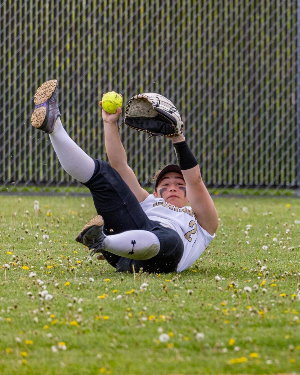 Corning outfielder, Ellie DeRosa makes a diving, sliding catch Saturday at Chenango Valley High School on the way to a 6-2 victory over Maine Endwell in the STAC championships.