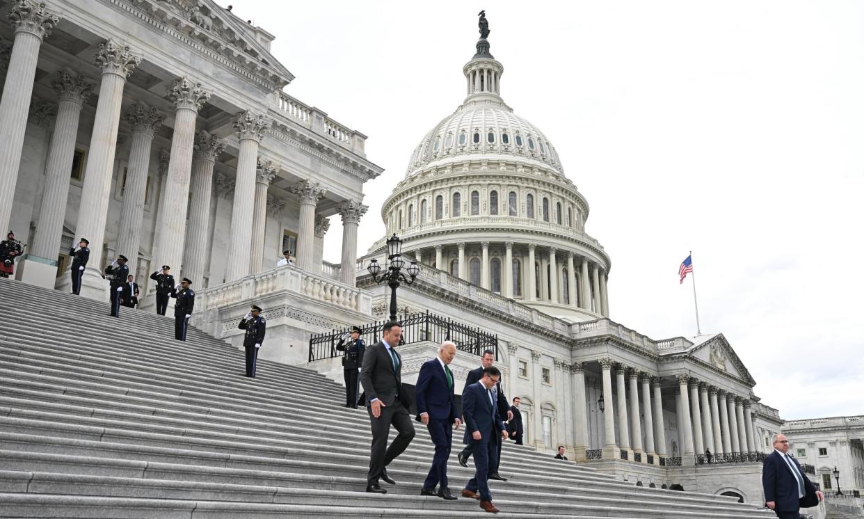 <span>Joe Biden and lawmakers at the US Capitol in Washington DC last week.</span><span>Photograph: Jim Watson/AFP/Getty Images</span>