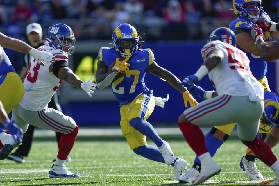 Los Angeles Rams' Darrell Henderson, center, runs the ball during the second half of an NFL football game against the New York Giants, Sunday, Oct. 17, 2021, in East Rutherford, N.J. (AP Photo/Frank Franklin II)