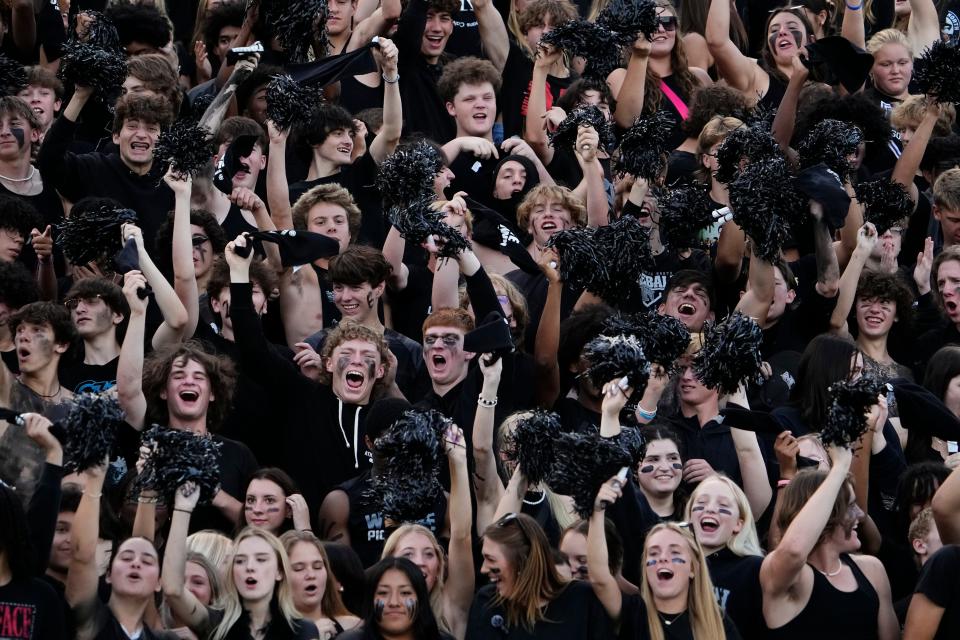 Pickerington North students cheer during their team's 39-34 win over Pickerington Central on Friday.