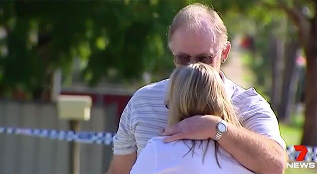 McClenahan-Ernst's grandparents grieving at the family's property. Source: 7 News