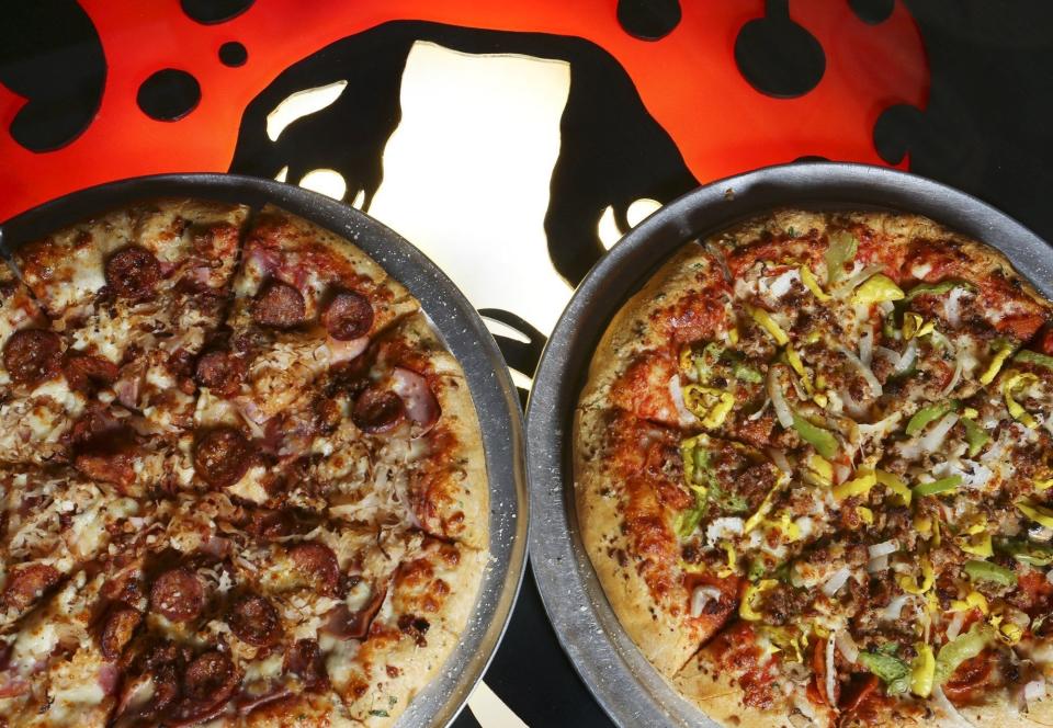 Hot Mama pizza with cajun links and Supreme Dog pizza (right) at Hounddog's 3 Degree Pizza in Columbus June 7, 2018.[Eric Albrecht/Dispatch]