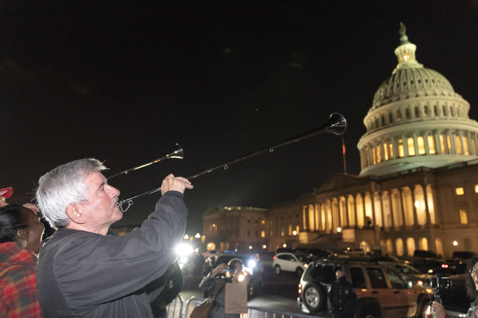 Supporters celebrate the Supreme Court confirmation of Amy Coney Barrett, Monday, Oct. 26, 2020, outside the Capitol in Washington. (AP Photo/Jacquelyn Martin)