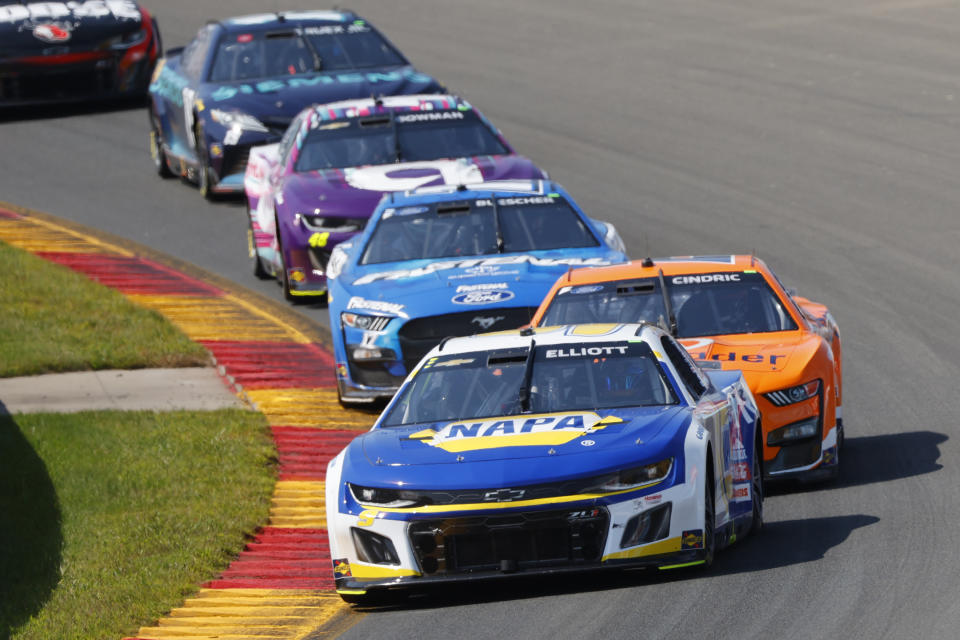 Chase Elliott leads the pack during a NASCAR Cup Series auto race in Watkins Glen, N.Y., Sunday, Aug. 20, 2023. (AP Photo/Jeffrey T. Barnes)