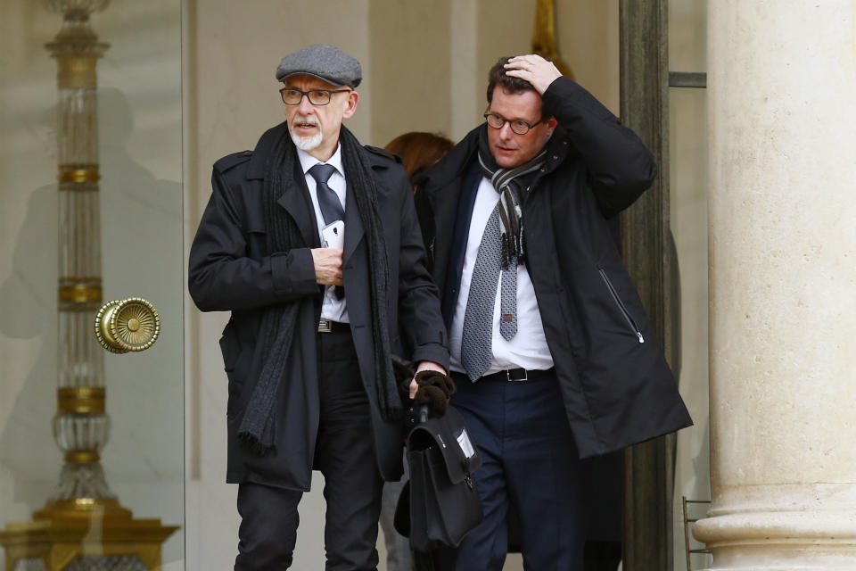 FILE - In this March 21, 2016, file photo, Georges Salines, left, whose daughter was killed in the 2015 Paris attacks by Islamic militants, and family victims' lawyer Jean Reinhart leave the Elysee Palace in Paris, after a meeting with French President Francois Hollande and other officials. Salines said the Oct. 26, 2019, death of Islamic State leader Abu Bakr al-Baghdadi, who inspired the attacks, brought a welcome “sense of satisfaction.” (AP Photo/Francois Mori, File)