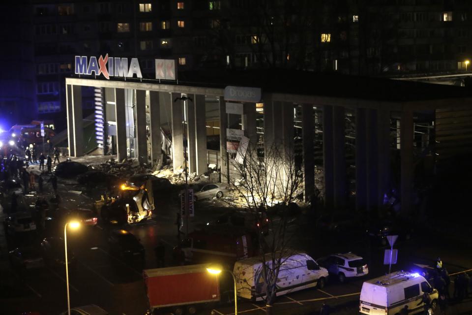 A general view shows a store with a collapsed roof in Riga