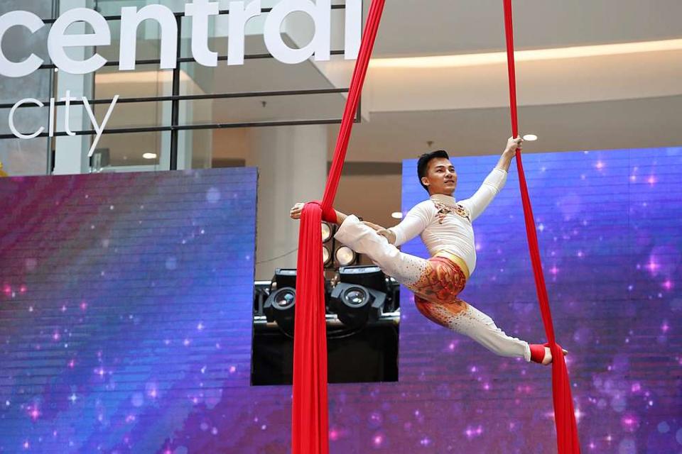 Leng Rachanikara soars through the air during the rope dance performance at the grand opening. — Picture by Choo Choy May