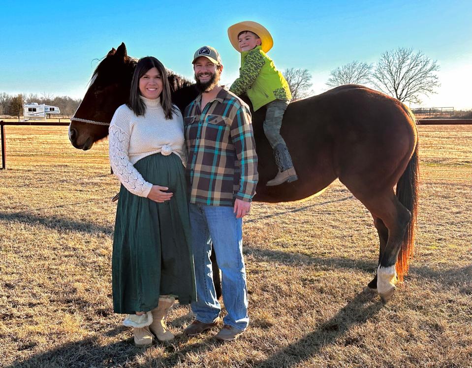 Erika and James Felder stand beside their son Wyatt, 5, as he sits atop Pickles at their home and award-winning Airbnb rental outside Calera, near Durant.