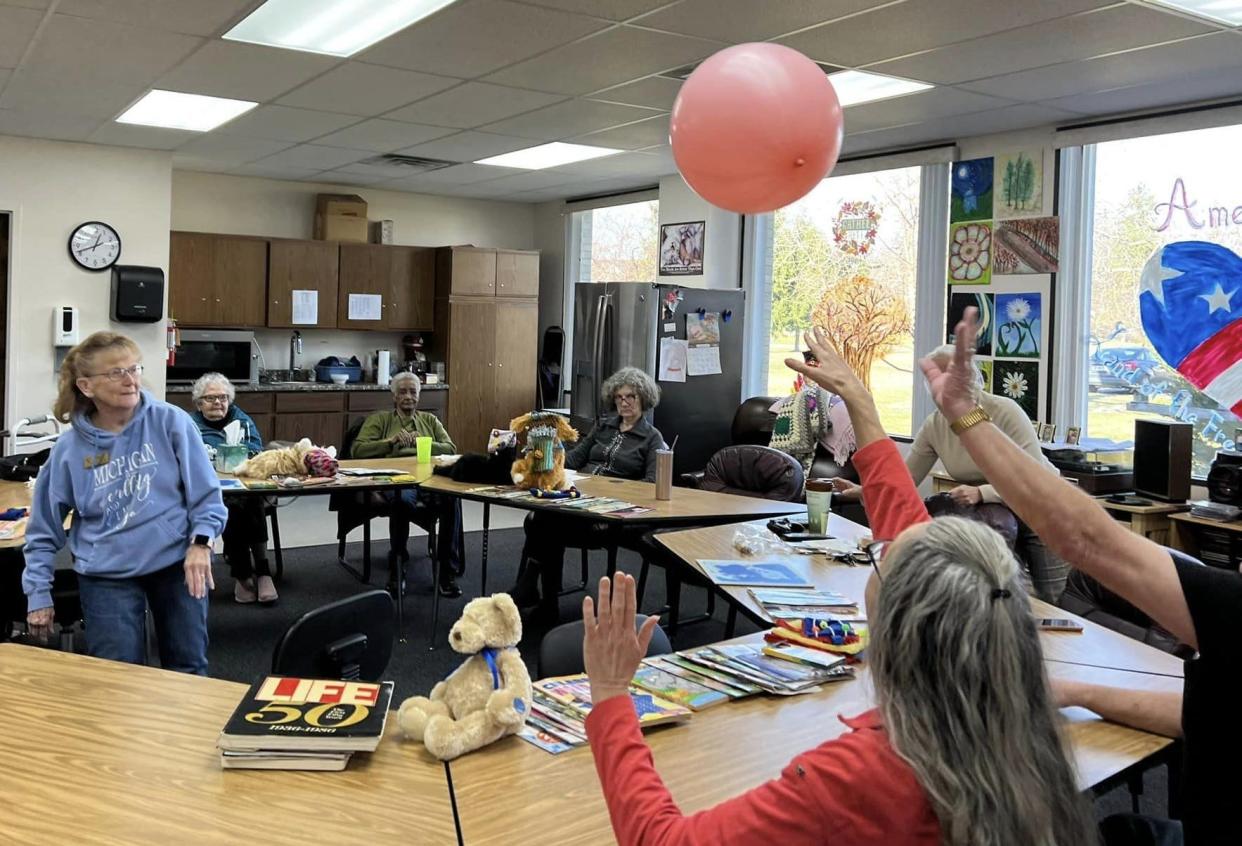 Nancy Jones, left, facilitates a game of balloon bash at the Dementia Adult Day Care Program at the Frenchtown Senior Citizens Center, 2786 Vivian Road.