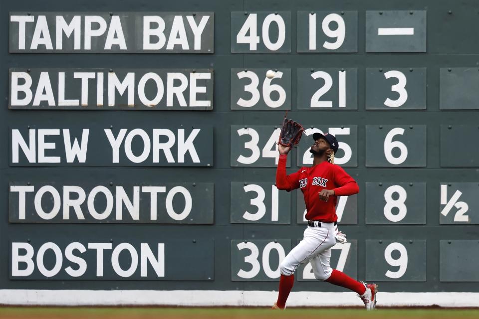 Boston Red Sox's Raimel Tapia catches a fly ball hit by Tampa Bay Rays' Brandon Lowe during the third inning of the second baseball game of a doubleheader Saturday, June 3, 2023, in Boston. (AP Photo/Michael Dwyer)