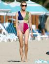 <p>Diane Kruger takes a walk along the beach in a sparkly color-blocked bathing suit on Monday in Los Angeles. </p>