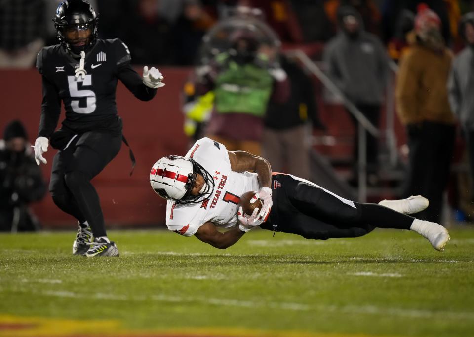 Texas Tech wide receiver Myles Price (1) extends to catch a 28-yard pass during the Red Raiders' 14-10 victory against Iowa State on Saturday at Jack Trice Stadium in Ames, Iowa.