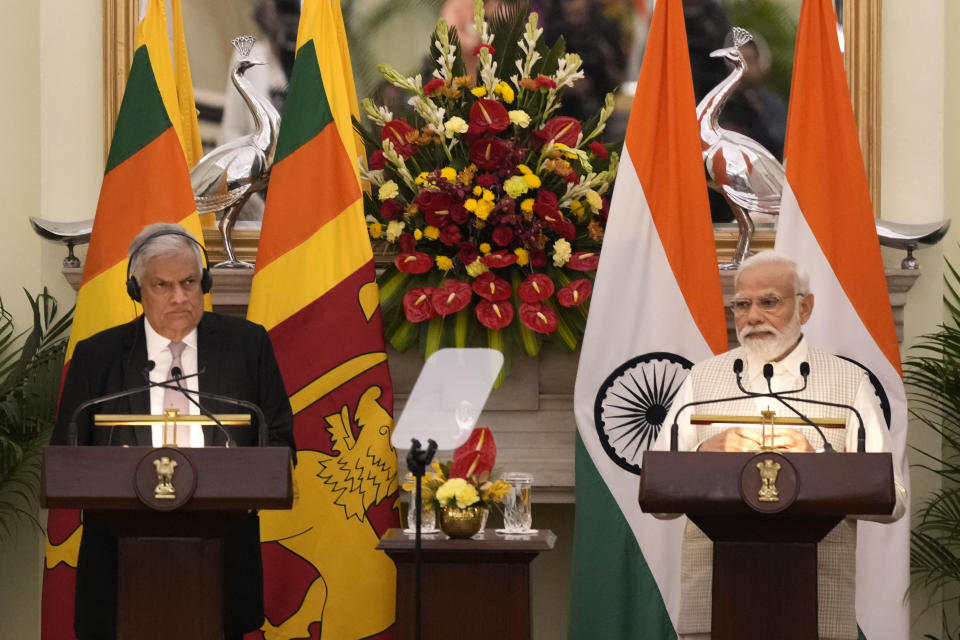 Indian Prime Minister Narendra Modi makes a press statement with Sri Lankan President Ranil Wickremesinghe by his side after their delegation level meeting in New Delhi, India, Friday, July 21, 2023. (AP Photo/Manish Swarup)