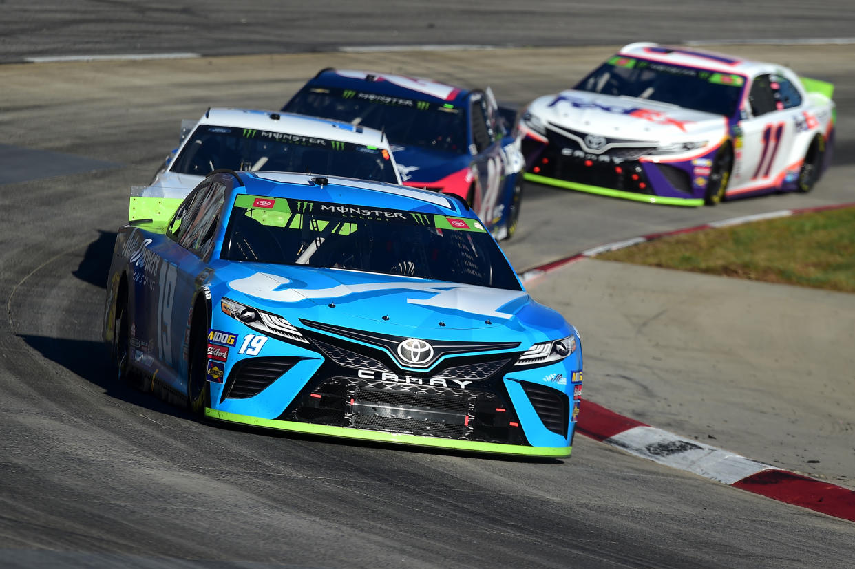 MARTINSVILLE, VIRGINIA - OCTOBER 27: Martin Truex Jr, driver of the #19 Auto Owners Insurance Toyota, leads a pack of cars during the Monster Energy NASCAR Cup Series First Data 500 at Martinsville Speedway on October 27, 2019 in Martinsville, Virginia. (Photo by Jared C. Tilton/Getty Images)