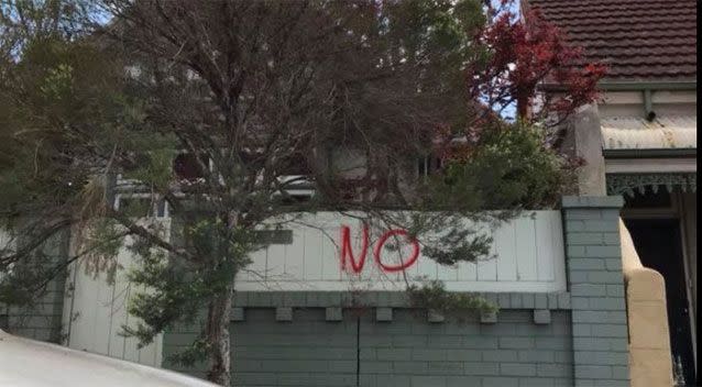 The word 'No' appears on the front fence of a residential house. Source: Facebook.