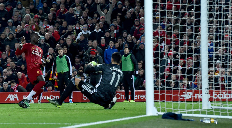 LIVERPOOL, ENGLAND - DECEMBER 29: (THE SUN OUT, THE SUN ON SUNDAY OUT) Sadio Mane  of Liverpool  scores the opening goal during the Premier League match between Liverpool FC and Wolverhampton Wanderers at Anfield on December 29, 2019 in Liverpool, United Kingdom. (Photo by John Powell/Liverpool FC via Getty Images)