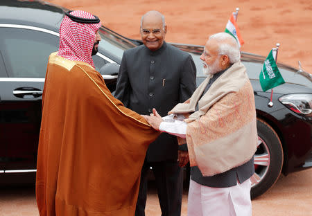 Saudi Arabia's Crown Prince Mohammed bin Salman is greeted by India's Prime Minister Narendra Modi as President Ram Nath Kovind watches during his ceremonial reception at the forecourt of Rashtrapati Bhavan in New Delhi, India, February 20, 2019. REUTERS/Adnan Abidi