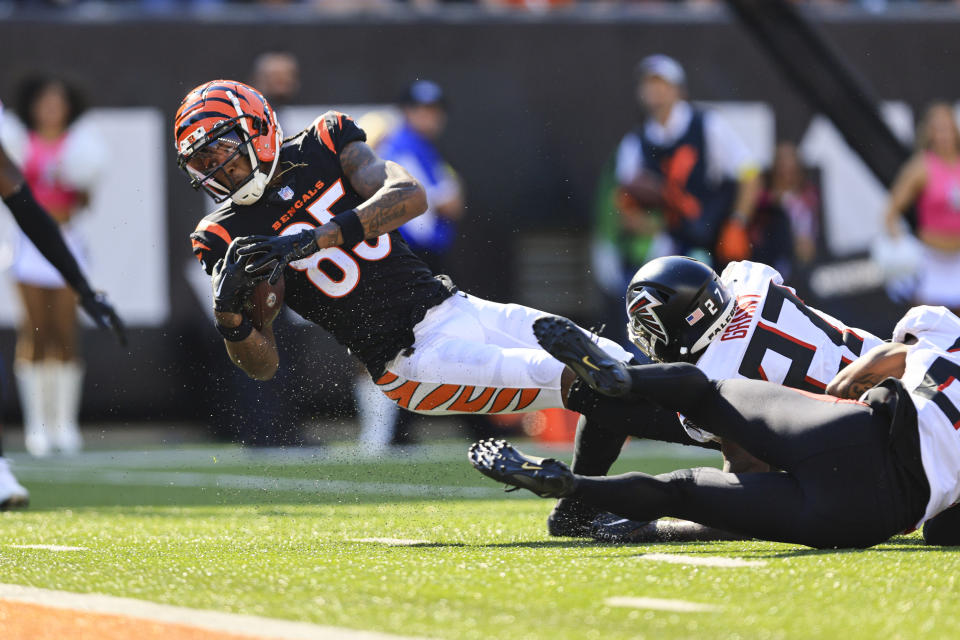 Cincinnati Bengals wide receiver Tee Higgins (85) is tackled by Atlanta Falcons safety Richie Grant (27) short of the end zone after a catch in the second half of an NFL football game in Cincinnati, Fla., Sunday, Oct. 23, 2022. (AP Photo/Aaron Doster)