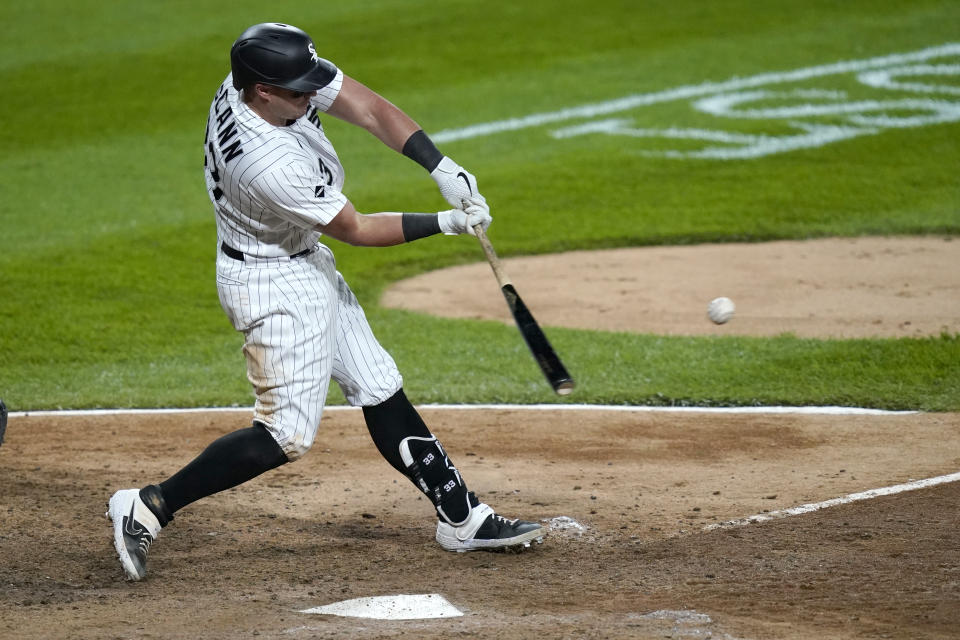 Chicago White Sox's James McCann hits a home run off Minnesota Twins relief pitcher Jorge Alcala during the seventh inning of a baseball game Tuesday, Sept. 15, 2020, in Chicago. (AP Photo/Charles Rex Arbogast)