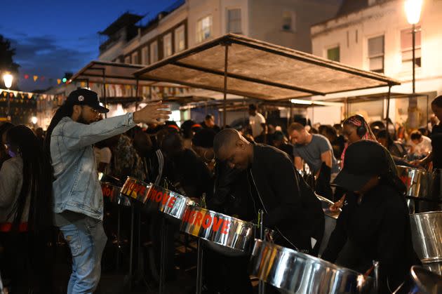 Andre White, the Mangrove Steelband's arranger, conducts the band's rehearsal on All Saints Road. (Photo: Clara Watt for HuffPost)