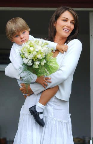 <p>Barry Batchelor - PA Images/PA Images via Getty</p> Elizabeth Hurley and son Damian Hurley in 2004