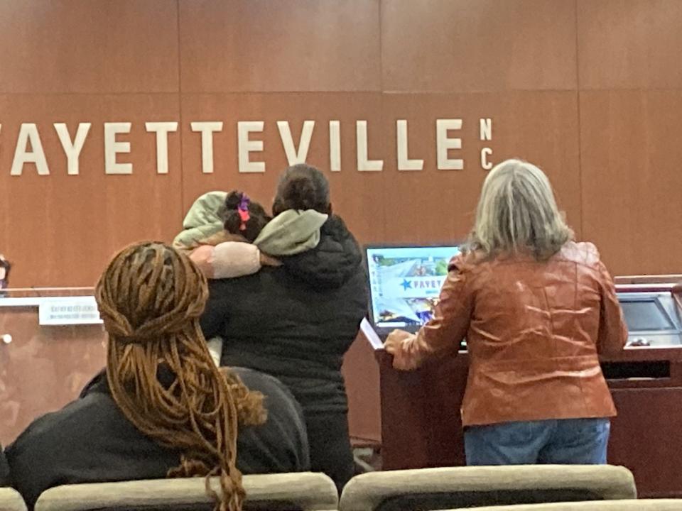 Activist Angela Tatum Malloy, right, speaks during the Monday, Jan 8., 2024, Fayetteville City Council meeting about concerns of homeless residents recently being bused to Durham, while one of the residents who almost went stands by.
