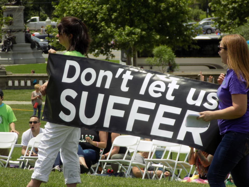 Kratom advocates hold up a sign at a rally outside the U.S. Capitol building last week. (Photo: Matt Kelley)