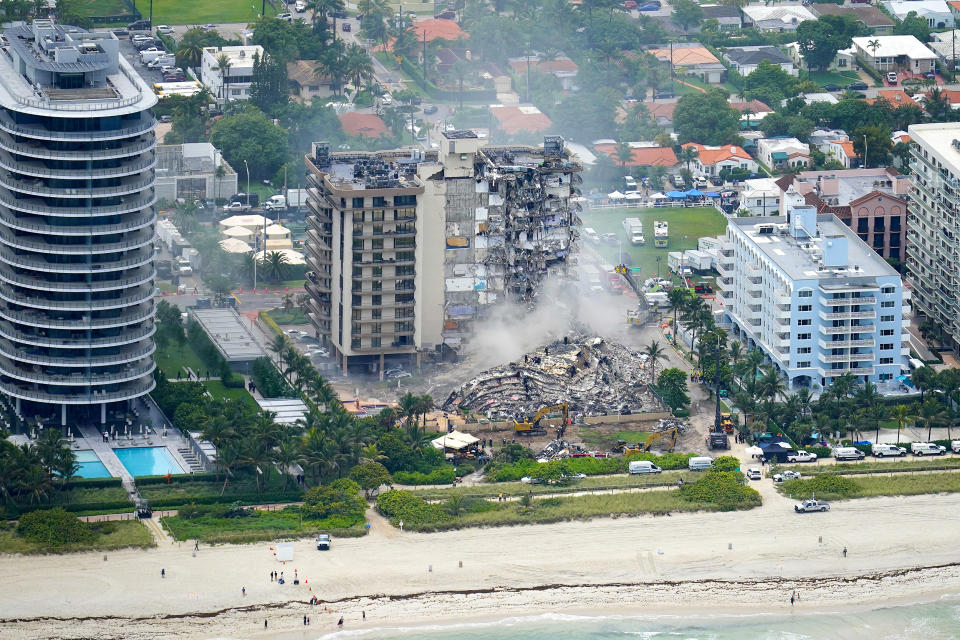 Image: Rescue personnel work in the rubble at the Champlain Towers South Condo on June 25, 2021, in Surfside. (Gerald Herbert / AP)