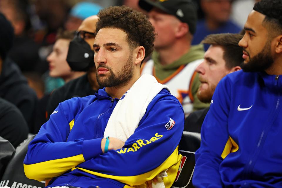 Golden State Warriors guard Klay Thompson (11) sits not he bench during the fourth quarter of the game against the Phoenix Suns at Footprint Center.