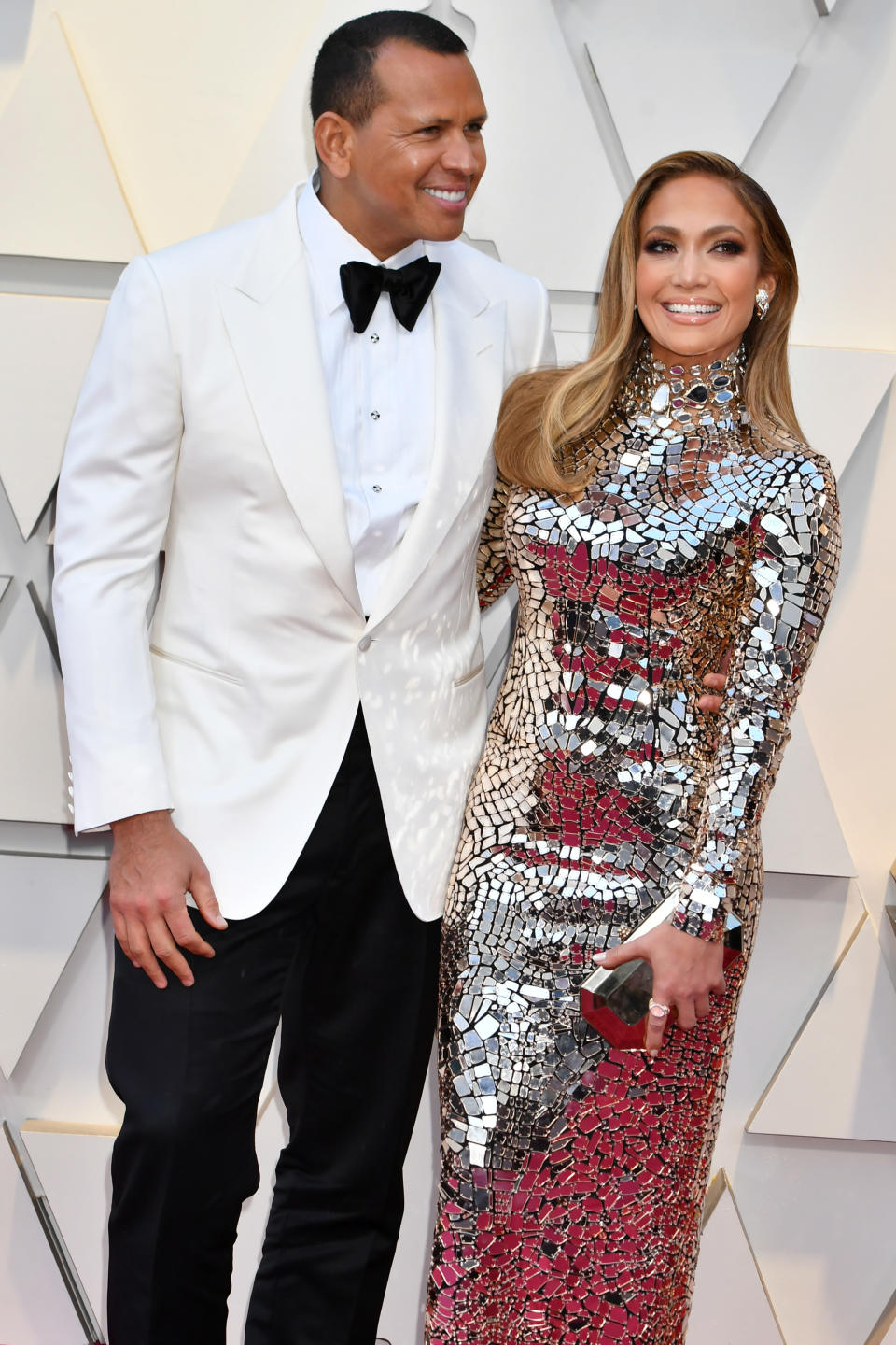 Alex Rodriguez and Jennifer Lopez in silver gown on the red carpet