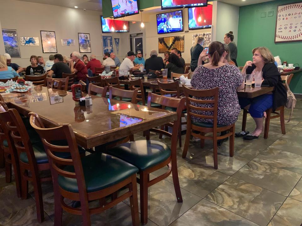At Tail Gators Brews & Grill we noticed a happy, boisterous group of people in the back of the restaurant moving from table to table playing poker for fun and gift certificates.