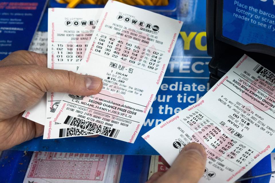 A Powerball customer checks his tickets at Rodman's Discount Gourmet in Washington, DC, USA, 01 November 2022. With no grand prize winners in nearly three months, the 02 November Powerball drawing will have an estimated value of 1.2 billion US dollars. It will be the fourth largest lottery jackpot in US history. Powerball jackpot reaches 1.2 billion US dollars, Washington, USA - 01 Nov 2022