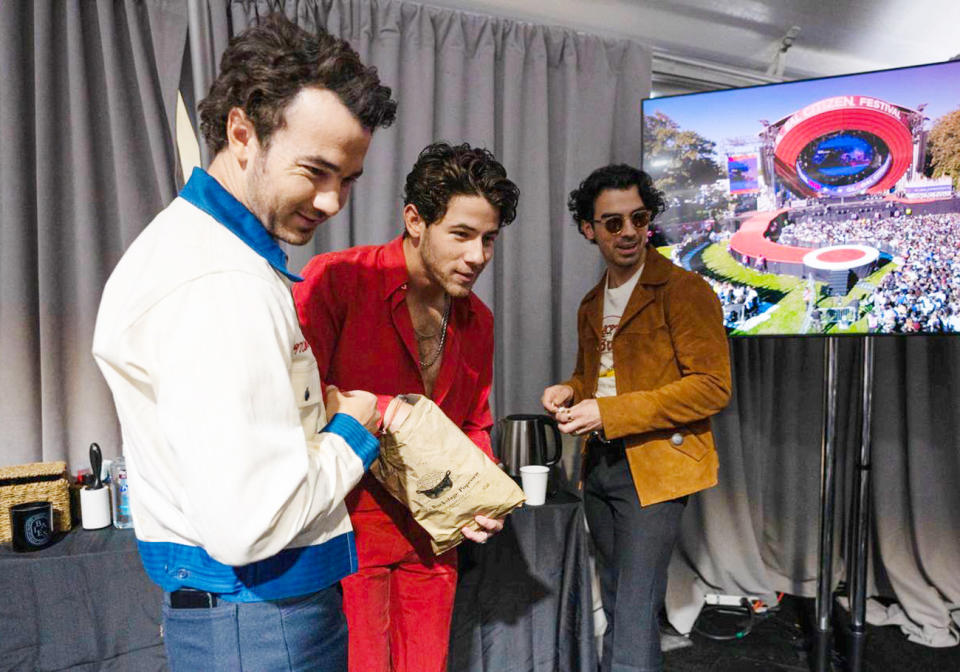 <p>The Jonas Brothers — Kevin, Nick and Joe — enjoy a bite of their Rob's Backstage Popcorn before their Global Citizen Festival performance in N.Y.C. on Sept. 24. </p>