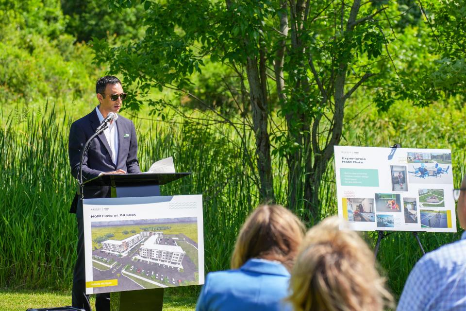 Magnus CEO Vishal Arora addresses the crowd during Thursday, June 6, during a groundbreaking ceremony for HōM Flats at 24 East.