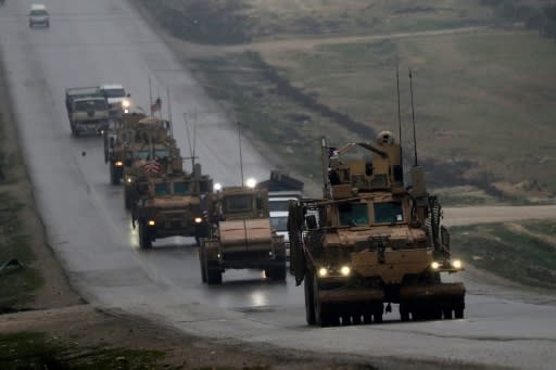 US military vehicles patrol Syria's flashpoint northern city of Manbij on December 30, 2018