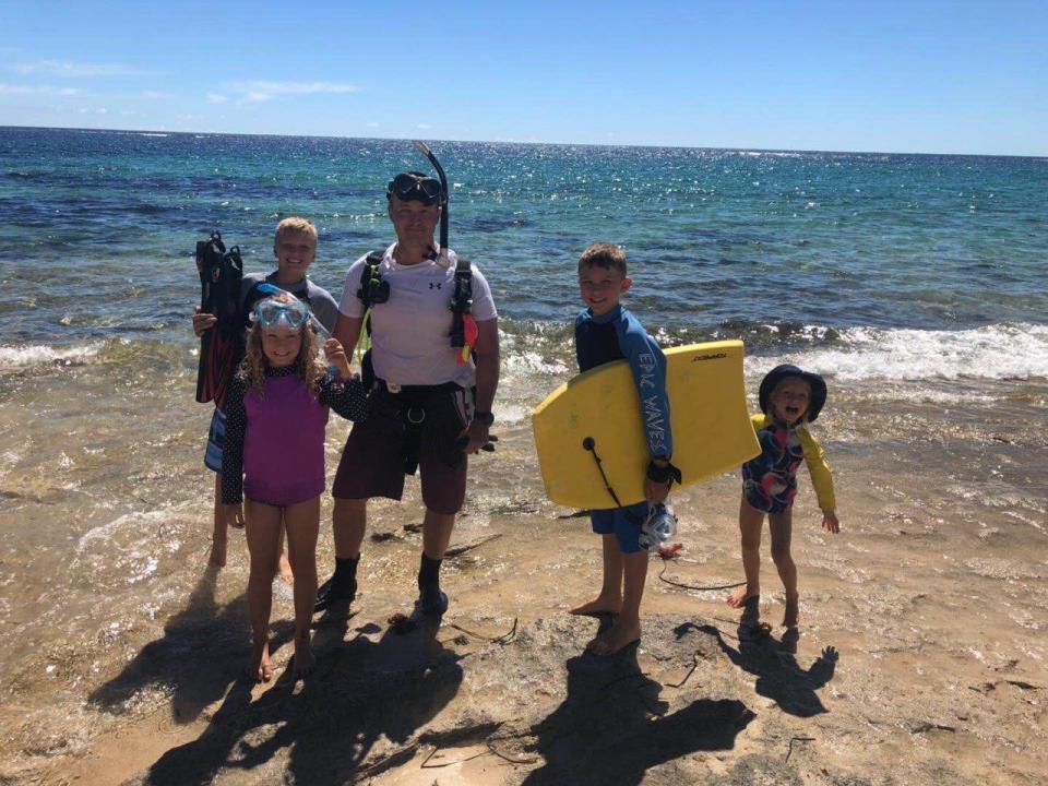 Mark with his four kids. Image: Supplied