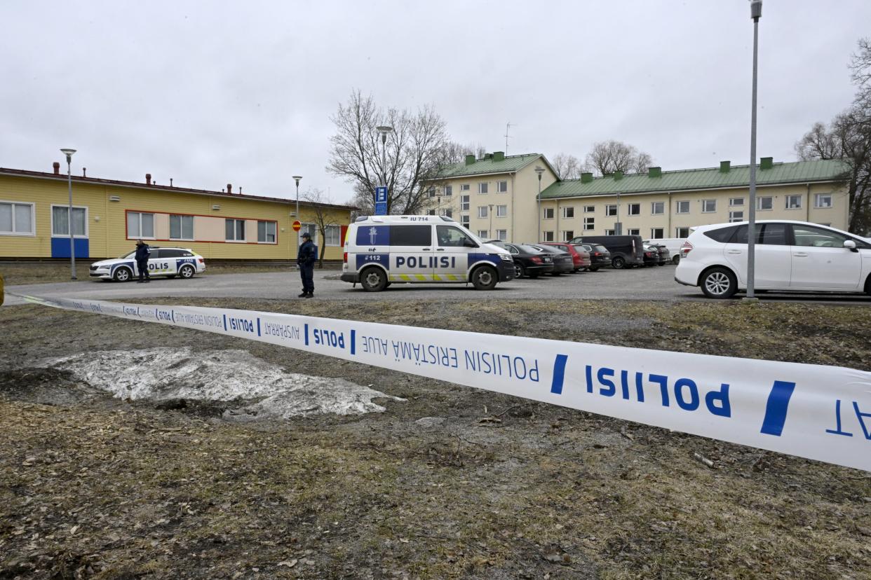 Finnish police officers guard the scene behind police tapes at the primary Viertola comprehensive school where a child opened fire and injured three other children, on April 2, 2024 in Vantaa, outside the Finnish capital Helsinki. Police said, that the attacker was in custody, and "All those involved in the shooting incident are minors".