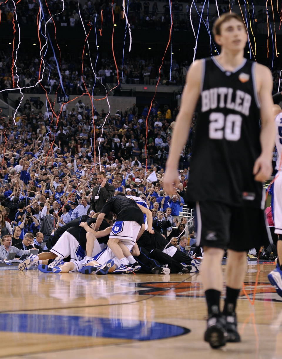 FILE - In this April 5, 2010, file photo, Duke players celebrate as Butler's Gordon Hayward (20) walks off the court at the end of the men's NCAA Final Four college basketball championship game, in Indianapolis. Duke won 61-59. The 2010s had some of the greatest NCAA Tournament games in college basketball history, from Duke's epic win over Butler in 2010 to Villanova's last-second win over North Carolina in 2016. (AP Photo/Mark J. Terrill, File)