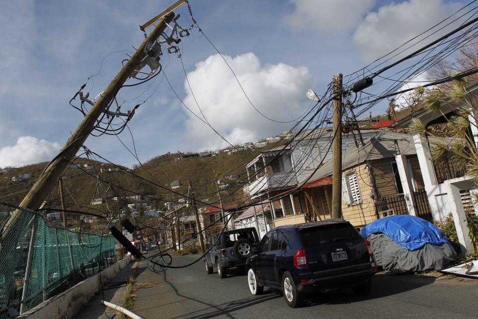 Power lines are damaged after the passage of Hurricane Irma in Charlotte Amalie, St. Thomas, U.S. Virgin Islands, Sunday, Sept. 10, 2017.(AP Photo/Ricardo Arduengo)