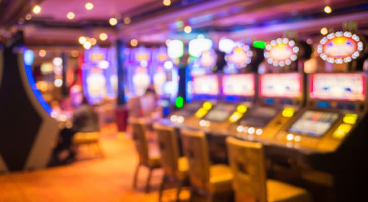 a room of slot machines in a casino to represent gambling stocks